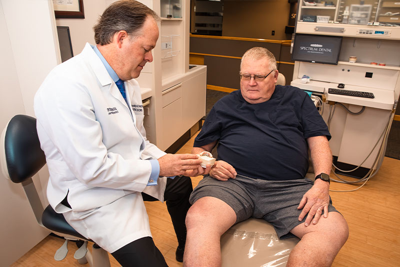Dr. purcell explaining dental implant procedure to patient